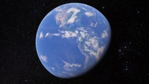 Imagen desde el espacio de un globo terrestre azul donde se distinguen Norte y Sudamérica, nubes y un borde en sombra sobre un fondo estrellado, texto alternativo accesible y optimizado para SEO que resume el enfoque visual: Ventajas y desventajas de Google Earth: secretos y limitaciones.