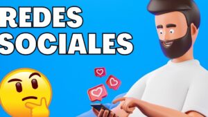 Ilustración colorida con fondo azul que muestra el texto destacado REDES SOCIALES, un emoji pensativo a la izquierda y un personaje 3D con barba sonriendo mientras consulta su teléfono con notificaciones de corazones flotando, Ventajas y desventajas en las redes sociales: descubre su impacto real.