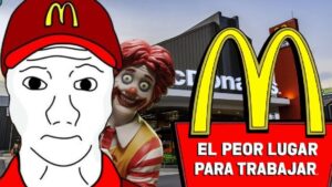 Fotomontaje que muestra a un trabajador dibujado con gorra roja de McDonald’s y expresión triste frente a la fachada del restaurante con los arcos dorados, el payaso Ronald McDonald detrás y un cartel rojo que proclama EL PEOR LUGAR PARA TRABAJAR, planteando Ventajas y desventajas de trabajar en McDonald’s: ¿es para ti?